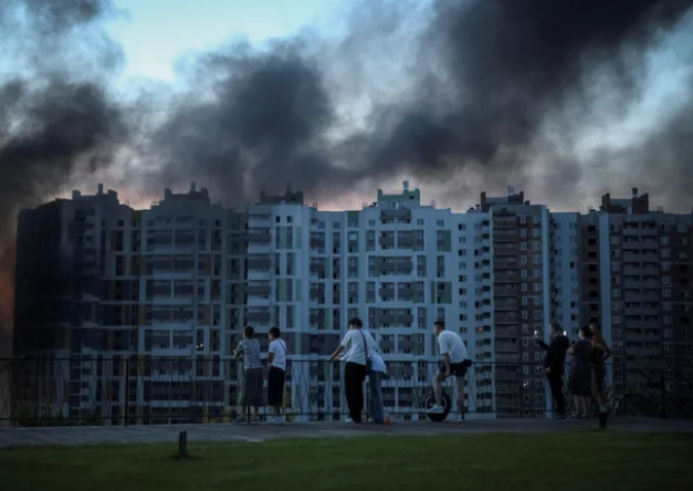 Firefighters work at the site of a shopping mall hit by Russian drone strikes in Kryvyi Rih, Ukraine