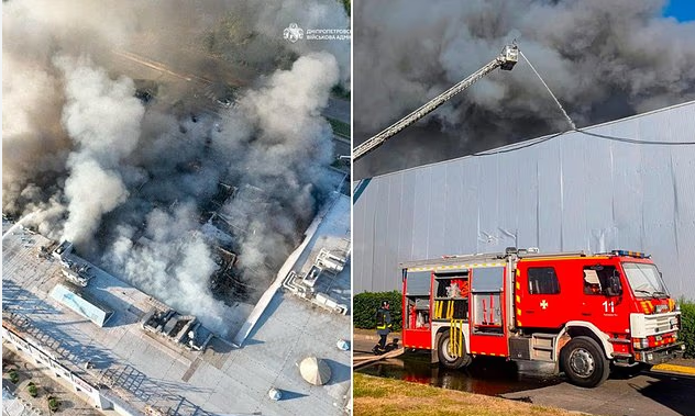 Firefighters work at the site of a shopping mall hit by Russian drone strikes in Kryvyi Rih, Ukraine