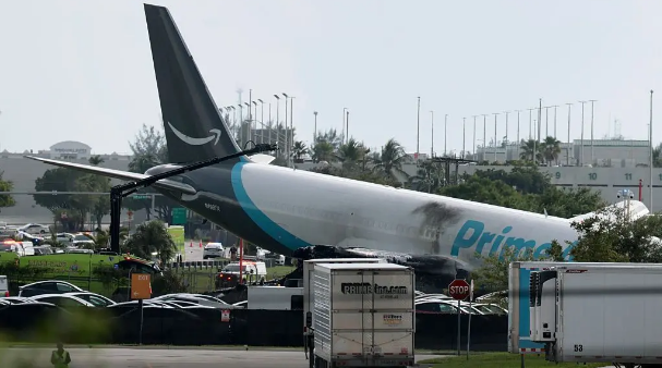 Amazon cargo plane overshoots runway and hits multiple vehicles at Miami airport