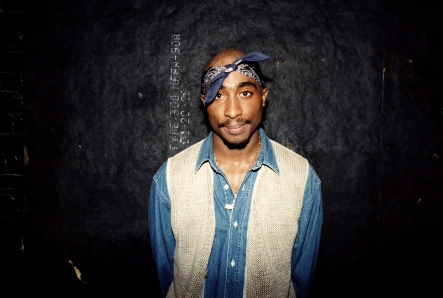 Tupac Shakur poses for a photo backstage after his performance at the Regal Theater in Chicago in 1994
