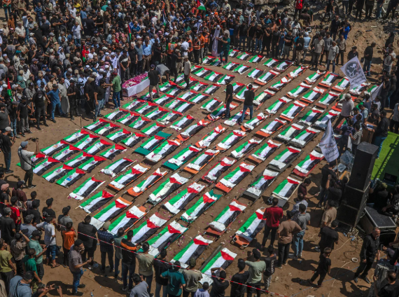 Mass funeral in Gaza for over 110 Palestinians found in rubble