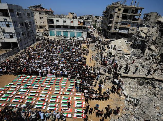 Mass funeral in Gaza for over 110 Palestinians found in rubble