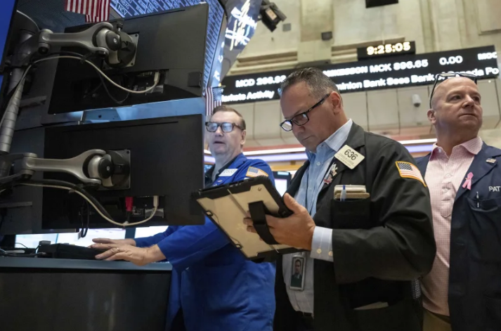 Trader Edward Curran works on the floor of the New York Stock Exchange, Thursday, Aug. 27, 2026, in New York.