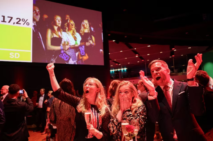 Supporters of Sweden's Social Democratic party react to early results of the general election in Stockholm, Sweden