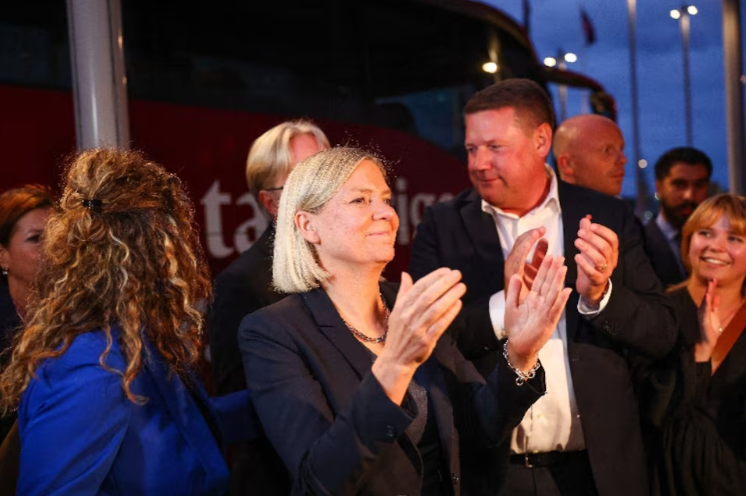 Opposition leader and Sweden's Social Democratic Party leader, Magdalena Andersson applauds