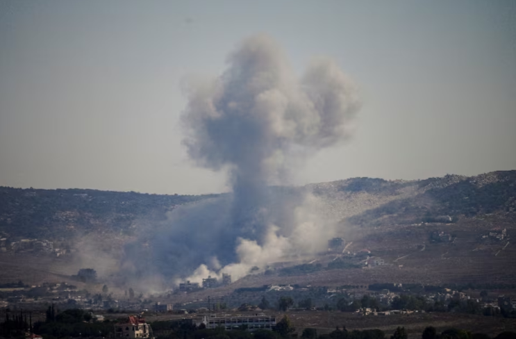 Smoke rises in southern Lebanon following an Israeli strike, as seen from Zawtar al-Gharbiyeh, southern Lebanon