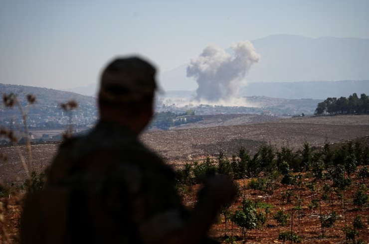 Smoke rises in southern Lebanon following an Israeli strike, as seen from Zawtar al-Gharbiyeh, southern Lebanon