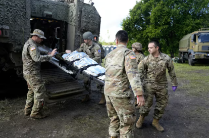 Members of the U.S. National Guard treat a simulated casualty during Vigorous Warrior 2026,