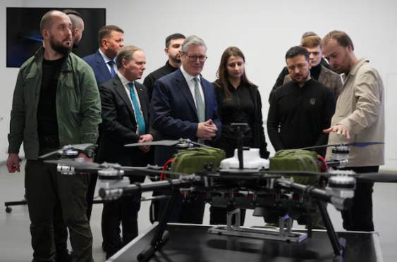 Former British Prime Minister Keir Starmer and Ukrainian President Volodymyr Zelenskiy inspect a Ukrainian military drone at an undisclosed location in Kyiv