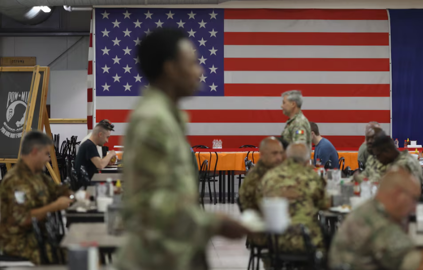Troops from the U.S. and other NATO countries mingle in the mess hall of Romania’s Mihail Kogalniceanu Air Base, where some streets are named after American states.