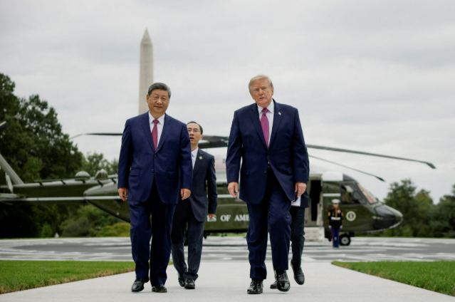 US President Donald Trump and China's President Xi Jinping speak before Xi leaves Joint Base Andrews, Maryland, US, September 23